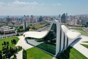 Aerial view of the Heydar Aliyev Centre in Baku, showcasing modern architecture and city landscape.
