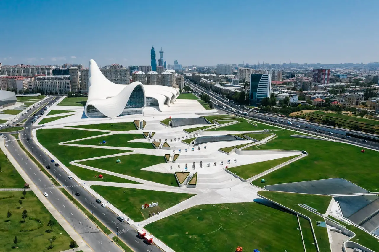 Stunning aerial shot of the Heydar Aliyev Center and urban landscape in Baku, Azerbaijan.